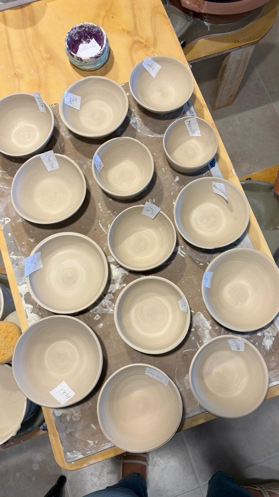 Hand-thrown bowls labeled with each kid's name