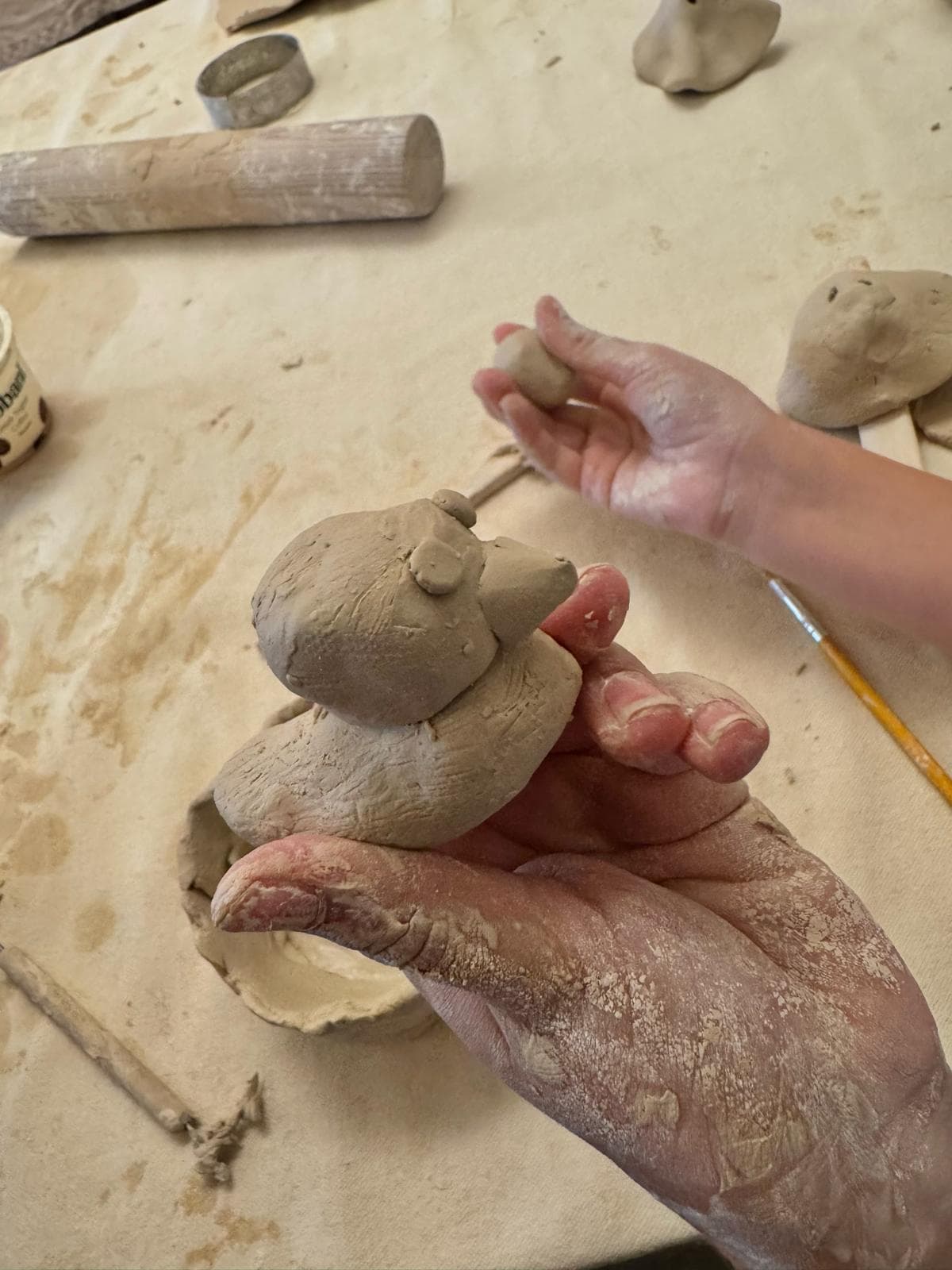 A hand-sculpted clay duck ready for the kiln