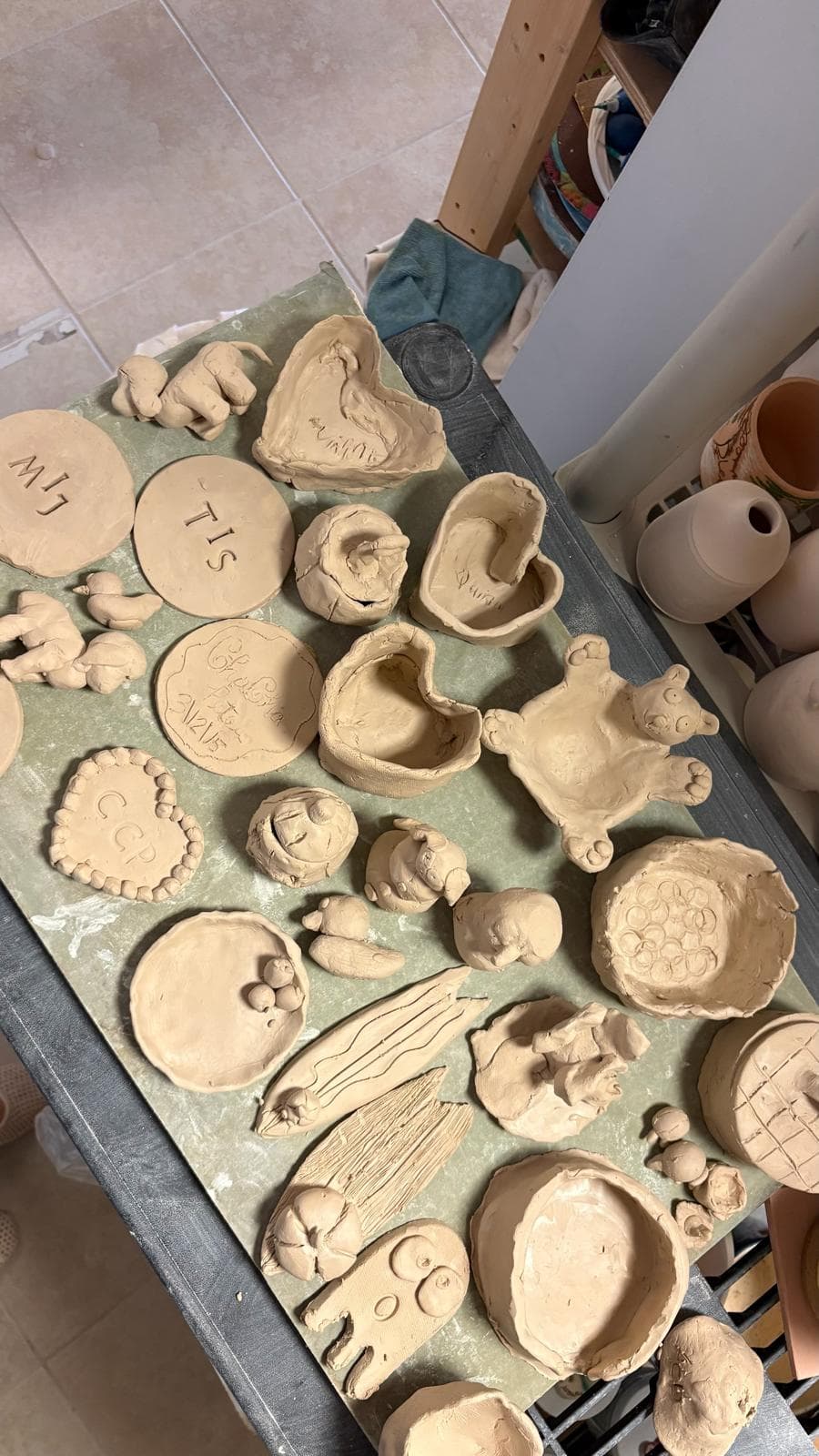 Clay creations drying on the studio table