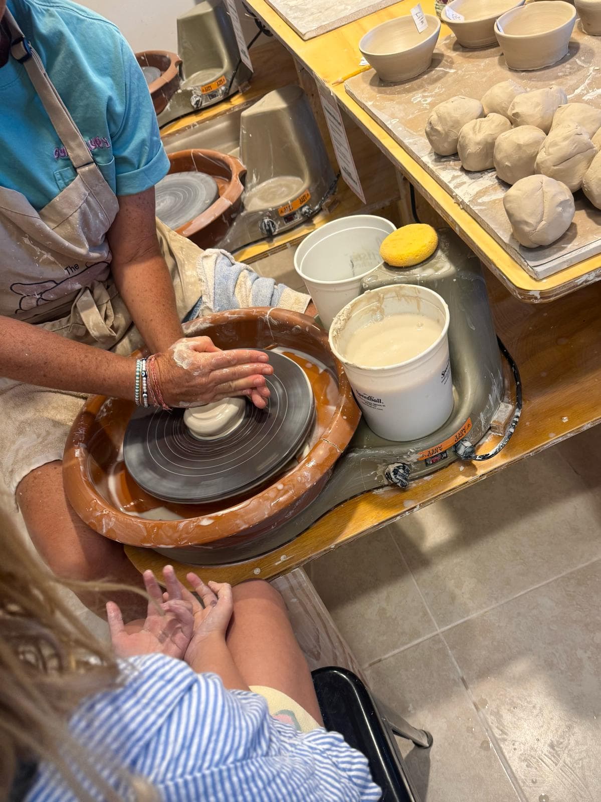 Learning to center clay on the pottery wheel
