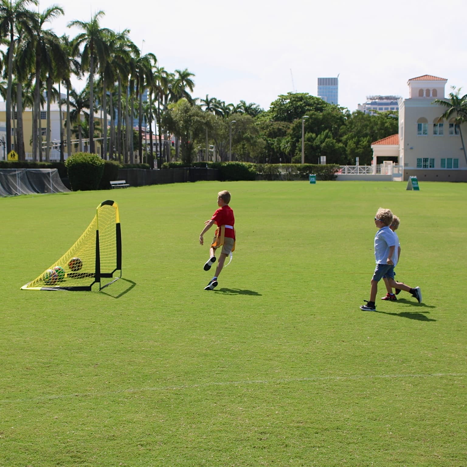 Kids racing toward the goal during field games