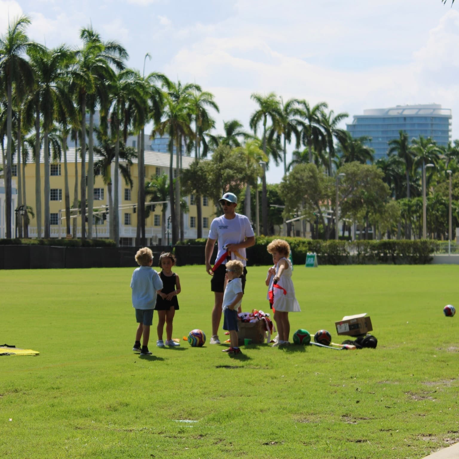 Coach leading flag games with young kids