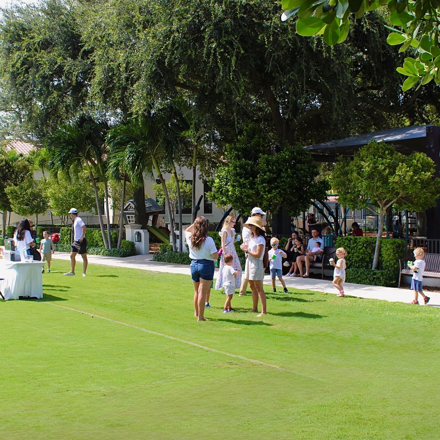 Families enjoying shaved ice along the walkway